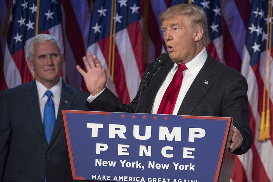 President-elect Donald Trump, joined on stage by running mate Mike Pence, speaks to supporters at the Election Night Party at the Hilton Midtown Hotel in New York City on Wednesday, Nov. 9, 2016. (J. Conrad Williams Jr./Newsday/TNS)