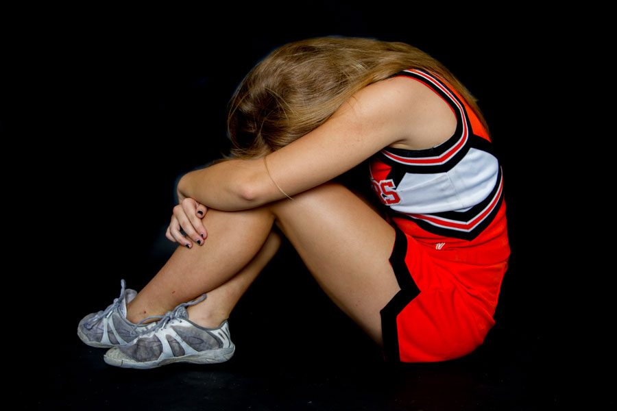 Photo Illustration: For the sake of appearances, parents often force their children to participate in activities they arent interested in, such as cheerleading. 