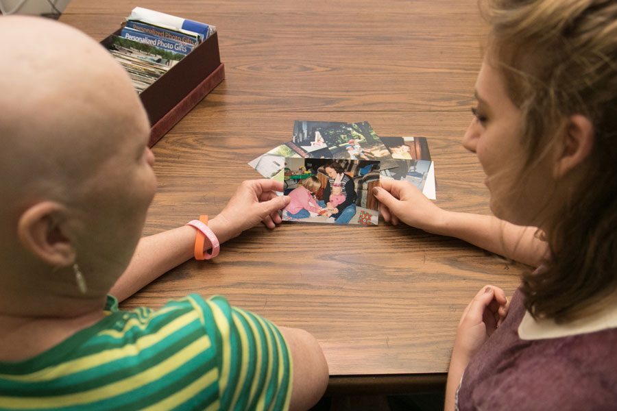 Tammy and Racheal Sizemore look at old pictures. Tammy was diagnosed with acute lymphoblastic leukemia in spring 2016 after previously recovering from breast cancer.