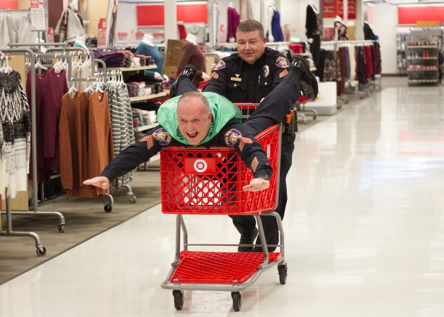 A couple of the police officers play around after the annual event of Shop With A Cop. This event took place December 6, 2017. 