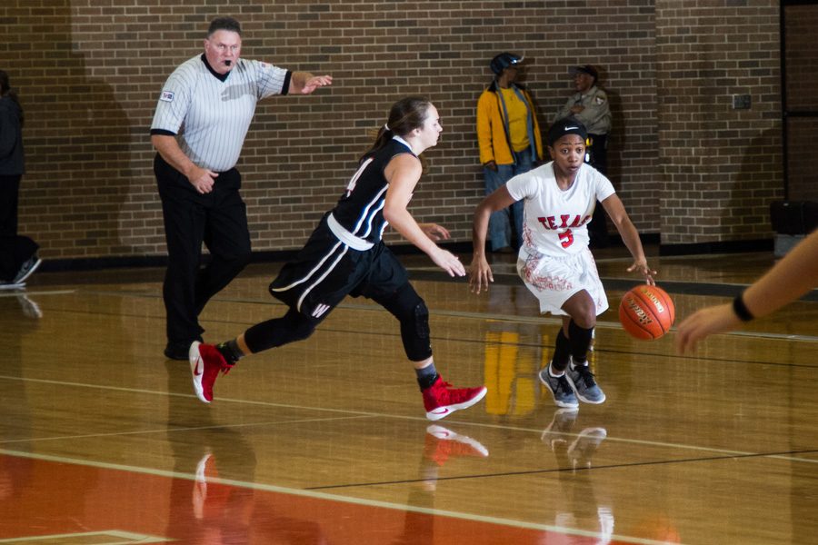 Senior Jasmine Brooks dribbles down the court looking to score for the Lady Tigers. District games for the girls and boys will begin in January 2017.