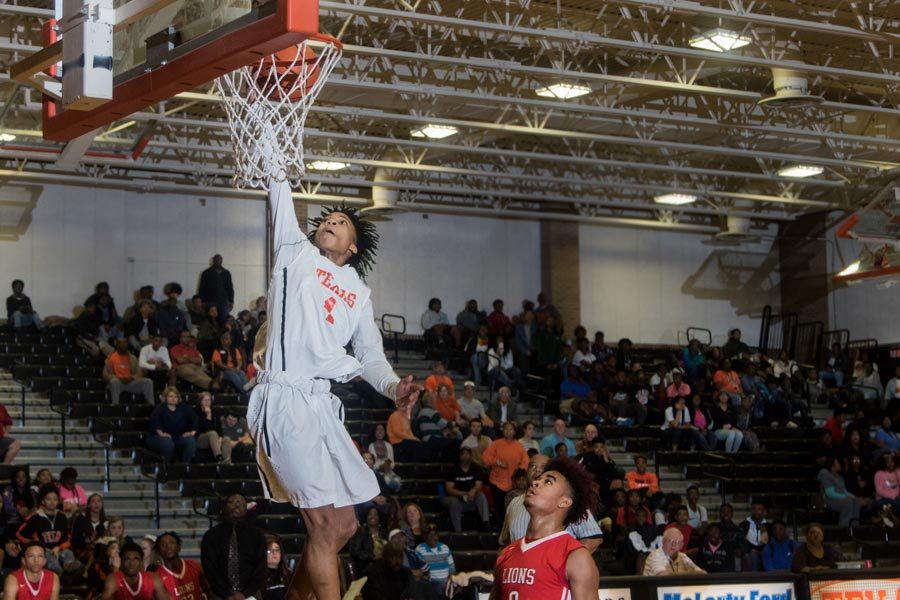 Texas Highs Chris Reid makes a lay up  against Greenville. The Tigers  defeated the Lions 89-51.