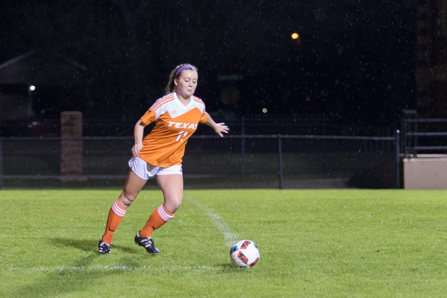 Sophomore Sarah Jane Paddock lunges towards the ball during the Spring Hill Lady Panthers Invitational. The girls varsity soccer team participated in this tournament Jan. 5.