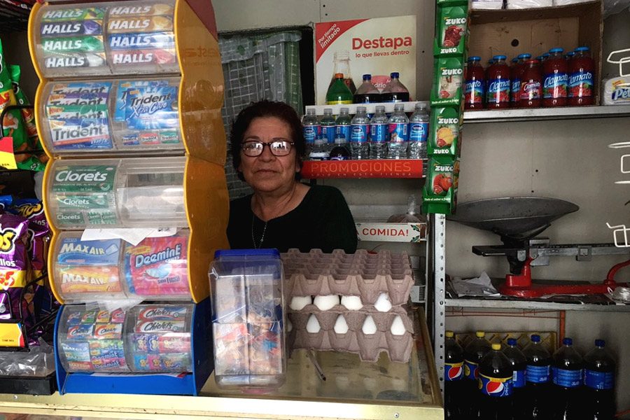 The mother of Félix Ramírez works a convenience stand. She has since returned to Mexico after her son was deported. 