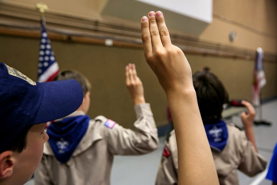 Boy Scouts recite the Pledge of Allegiance at a church in Bothell, Washington. Many churches have ended their affiliation with the Boy Scouts because of their decision to allow LGBT members and leaders.