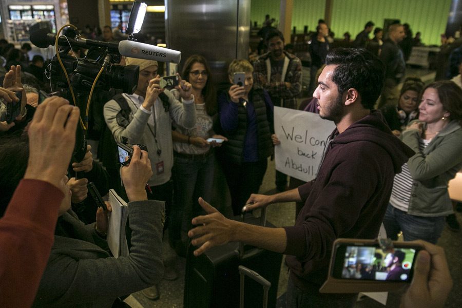 Abdullah Al Rifaie is interviewed by journalists after being greeted at Los Angeles International Airport by family a week after he was stuck outside the U.S. as part of the Trump administration travel ban. Photo by Robert Gauthier