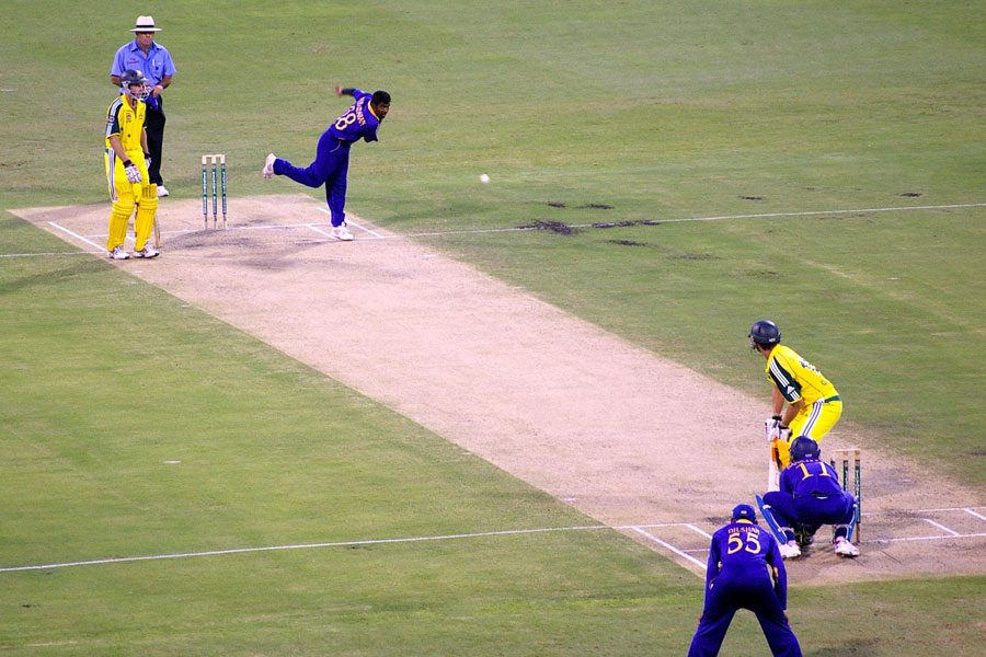 Muttiah Muralitharan bowls to Adam Gilchrist. Gilchrist went on to hit a centruy off 67 balls. Muralitharan finally bowled him for 122. Photo by Rae Allen