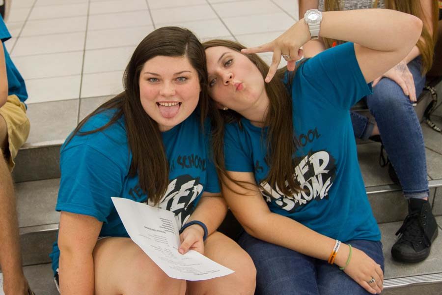 At the first Student Council meeting of the new school year, seniors Emily Meinzer and Mackenzie Burt pose for a silly candid. These gals became friends in the first grade. 