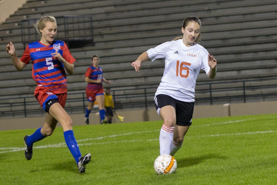 Rachael Shewmaker dribbles the ball away from an Evangel Christian opponent at the game on Jan. 3. Shewmaker broke the pervious record for career goals at the game on Jan. 27. 