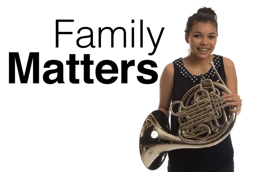 Sophomore Anna Loanzan poses with her French horn. Loanzans parents are both band directors, and she has been in band since the sixth grade. 