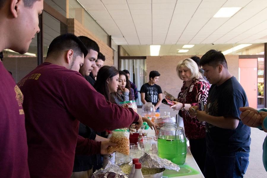 Members of Multicultural Club sell food during lunch. Funds go towards a trip for the club.