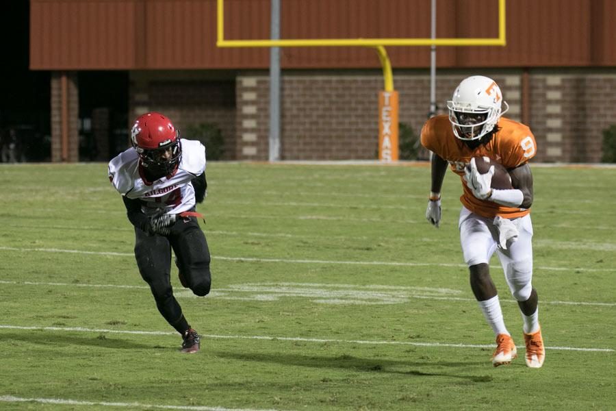 Junior starting receiver Tevailance Hunt rushes down the field at a game. Hunt has received several scholarship offers early in his high school career.