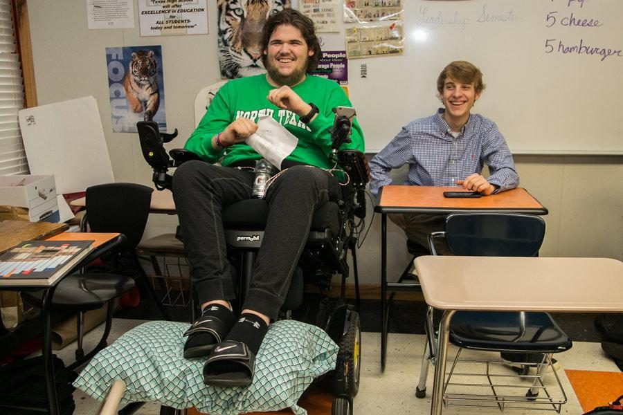 Senior Mayten Lumpkin laughs with senior Matt Wells during class. Lumpkins first day back was Feb. 27.