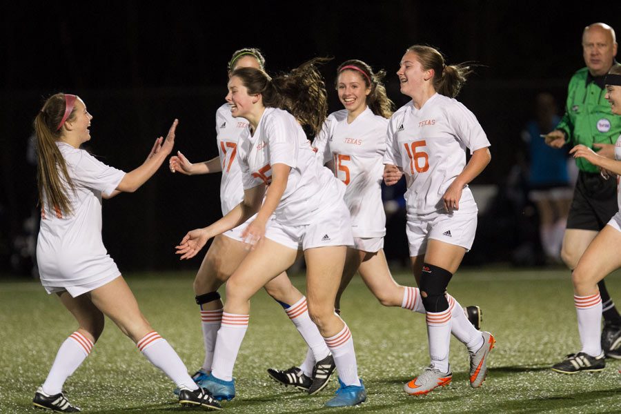 Sophomore+Sarah+Jane+Paddock+and+junior+Jillian+Ross+celebrate+after+a+5-2+victory+against+Greenville+on+March+7.+The+girls+soccer+season+ended+March+24+after+a+loss+in+playoffs.