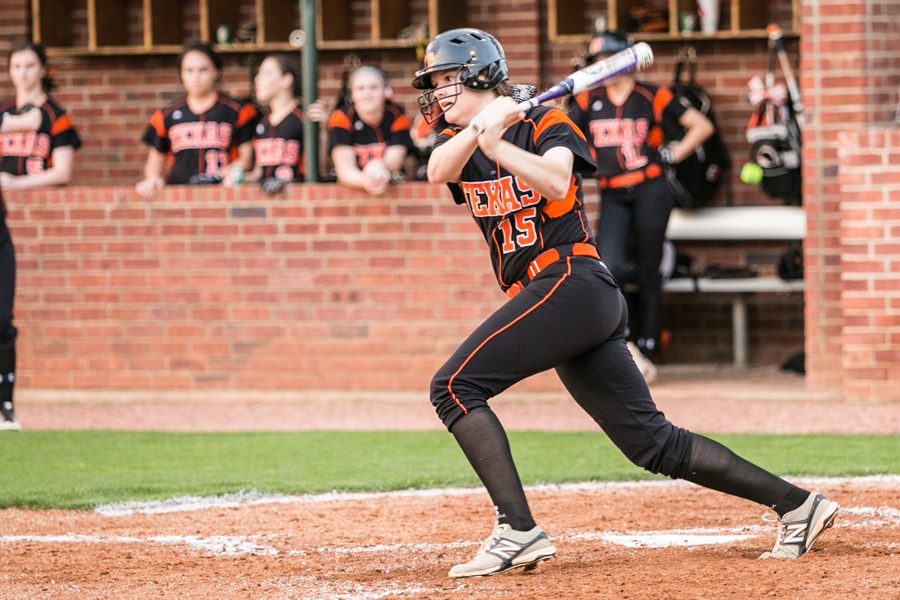 Sophomore Kaitlyn Cross exits the batters box after a base hit in the third inning in the Lady Tigers game against Greenville March 31, 2017. Texas High defeated Greenville 10 - 0.