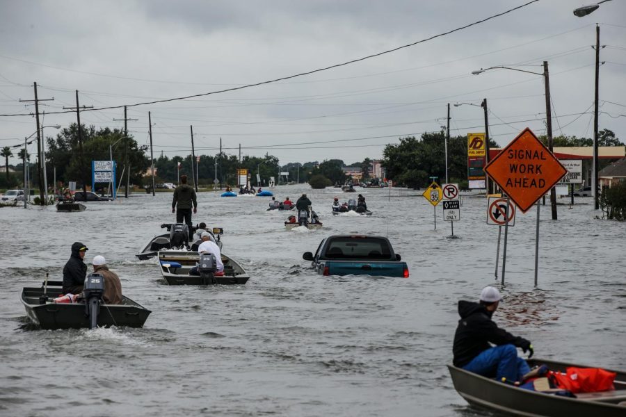 Flooding in Port Arthur, Texas causes boat traffic.