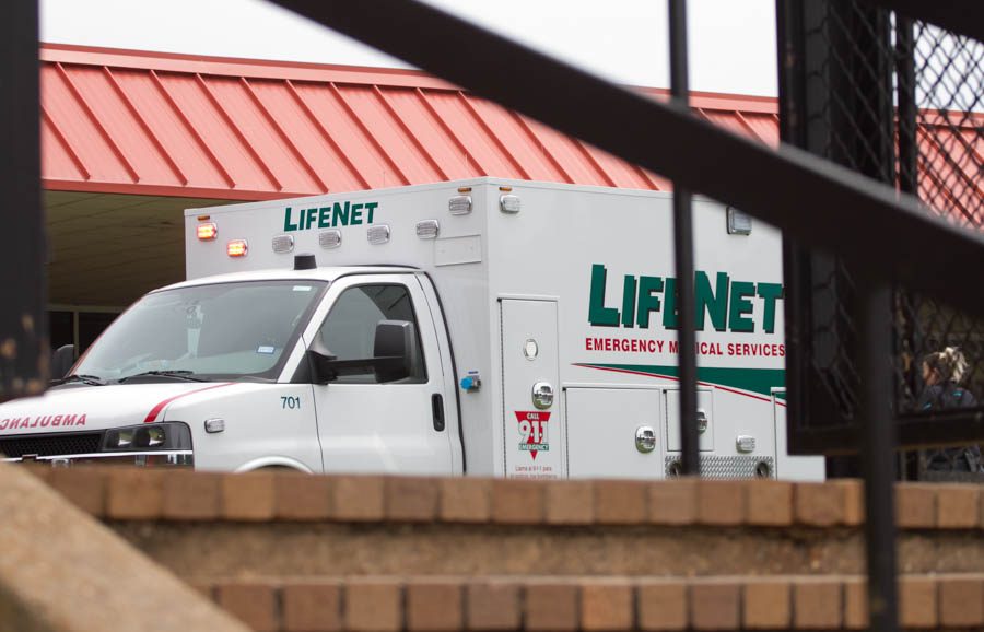 A LifeNet ambulance sits on the Texas High School campus Aug. 29, 2017. A student suffered a hand amputation in the Sullivan Performing Arts Center.
