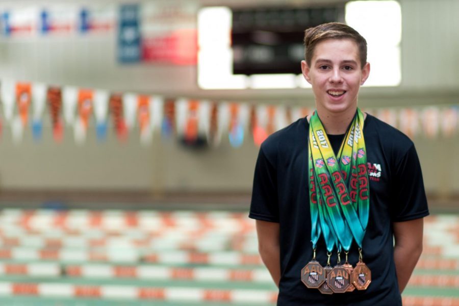 Freshman John David Cass swims competitively, not only on the Tigershark team, but nationally as well.