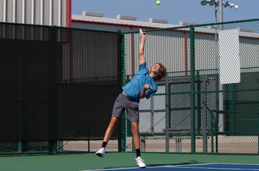 Sophomore Burris Moss reaches for the ball during practice.