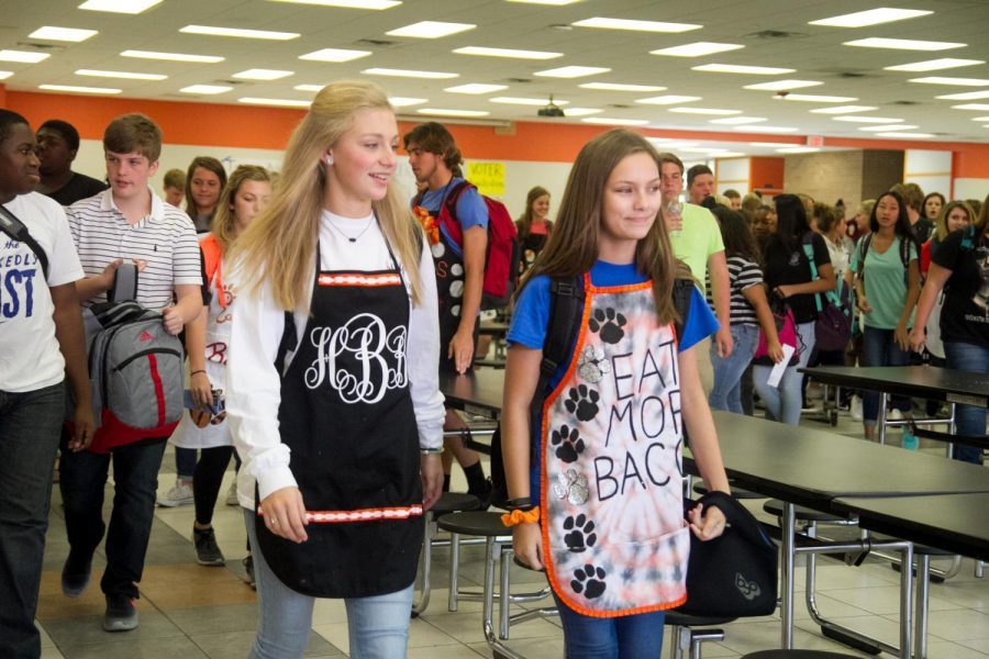 Juniors Hollan Borowitz and Madison Bowers dressed up for apron day last year.
