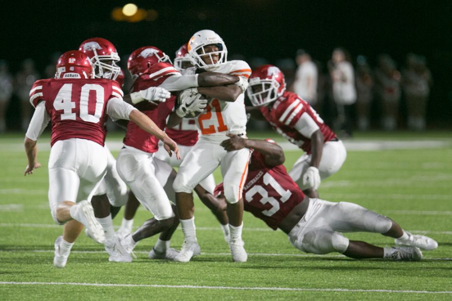 Texas Highs Chris Sutton struggles to gain yardage against a host of Arkansas High Defenders. The Tigers lost to the Razobacks 7-0. 