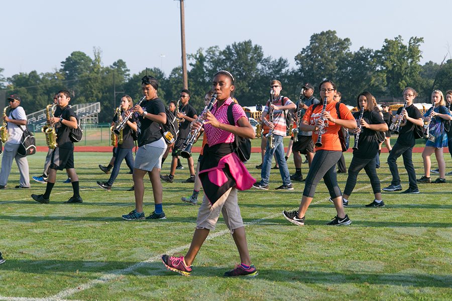 Students in band work every morning and afternoon to perfect their show Revolve.