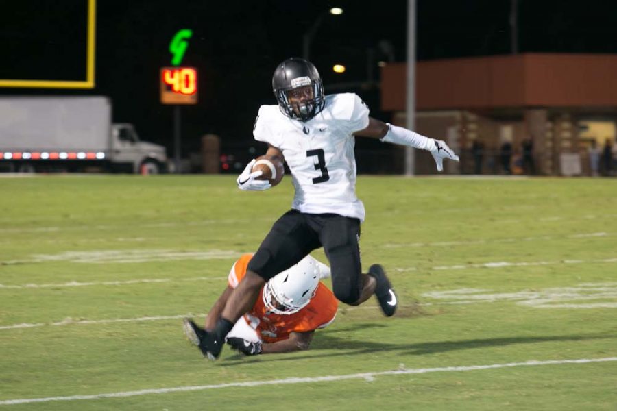 Bishop Lynchs Jarek Broussard rounds the corner against the Tigers on Sept. 1, 2017 at Grimm Stadium in Texarkana, Texas. The Friars capitalized on numerous Texas High turnovers to defeat the Tigers 24-7. 