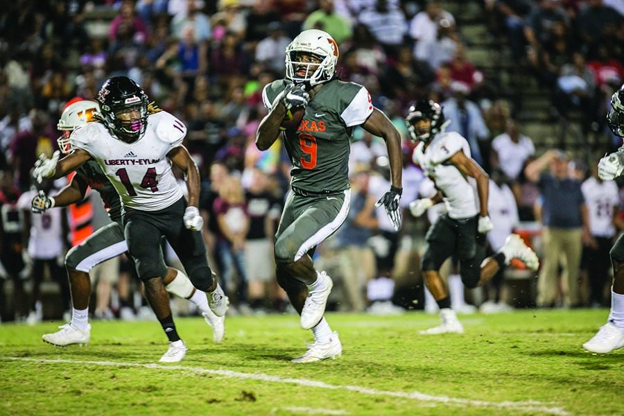 Wide receiver Tevailance Hunt sprints for a touchdown against Liberty-Eylau. Hunt reeled in six catches for 77 yards and a score in the 37-23 win.