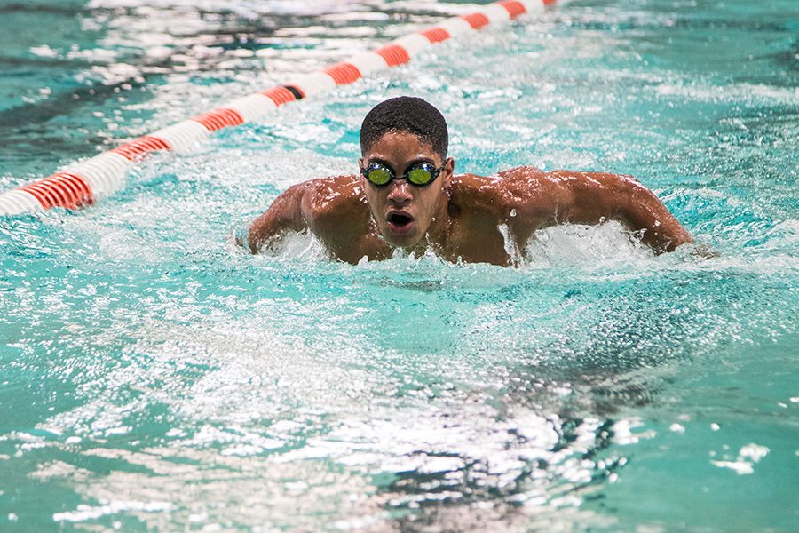 Junior Robert Bland races against his teammates in the first meet of the season.