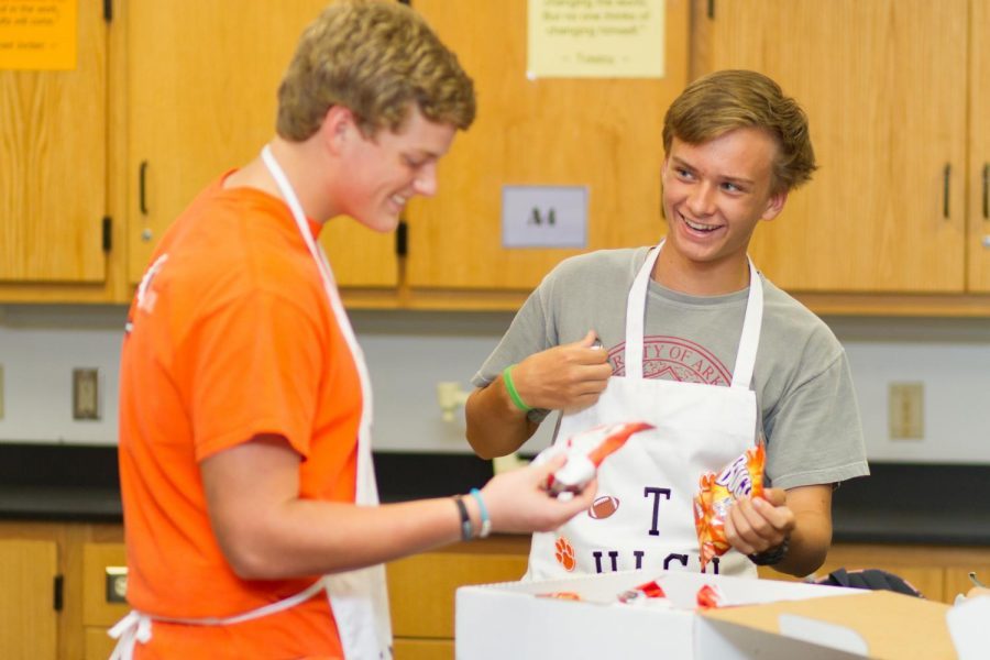 Juniors Cameron Radney and Griffin Johnson wear their custom made aprons for spirit week.