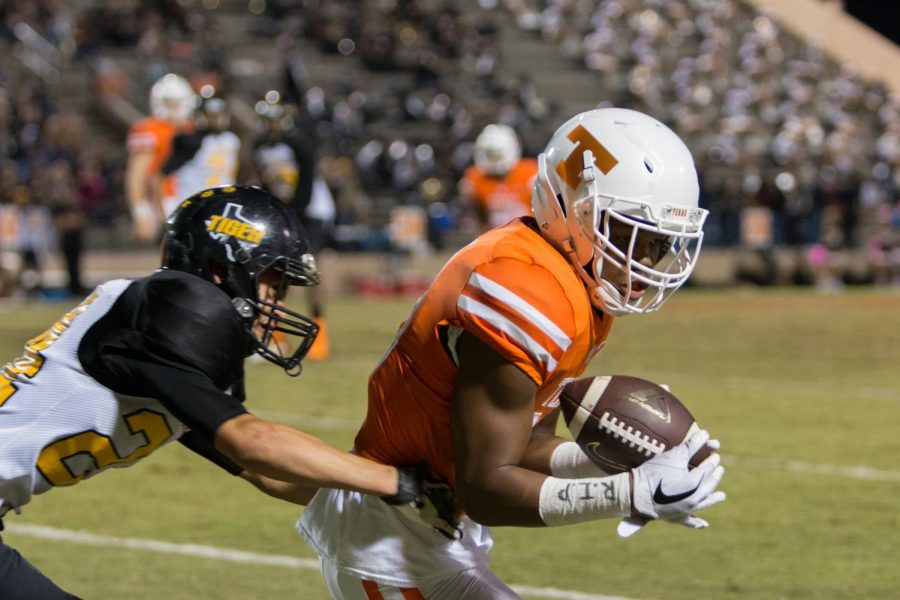 Kobe Webster advances the ball after the catch. The Tigers won with a score of 48-0. 