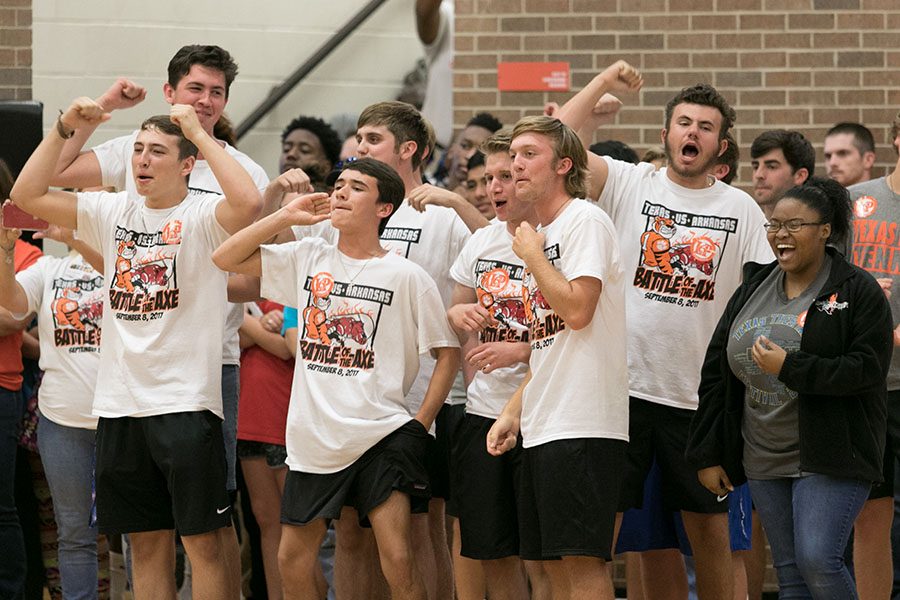 Seniors and juniors cheer at this years Texas vs. Arkansas pep rally.