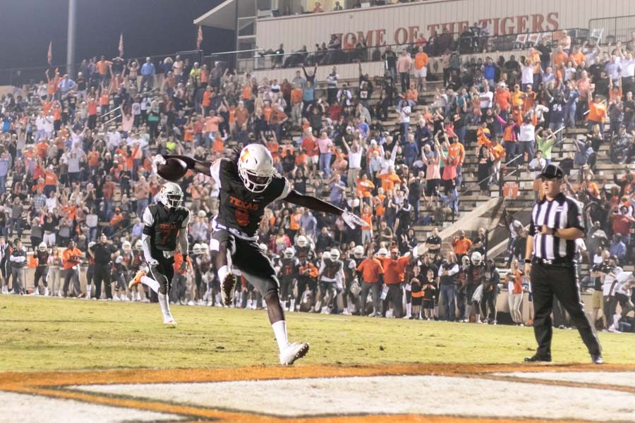 Senior Tevailance Hunt scores on a pass play from quarterback Riley Russell in the fourth quarter against the Hallsville Bobcats Nov. 4, 2017. Hunt scored multiple touchdowns in the game. 