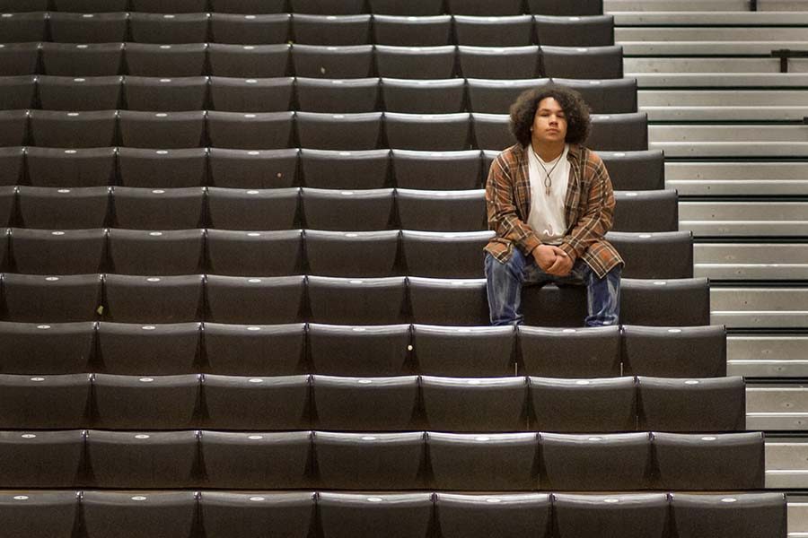 Keenan Thrapp sits alone on the bleachers in the Tiger Center to his feelings about mandatory pep rally attendance. Thrapp and other students that suffer from social anxiety no longer have a place to go during pep rallies.