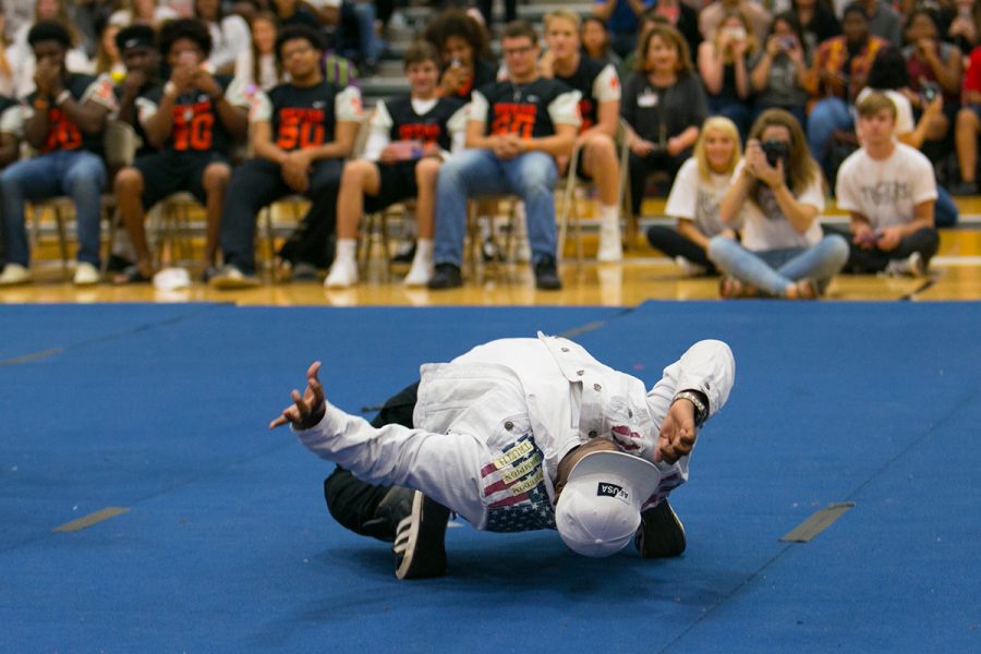 Astounding the audience, freshman Jurman Williams smoothly drops his body to the music during a pep rally.