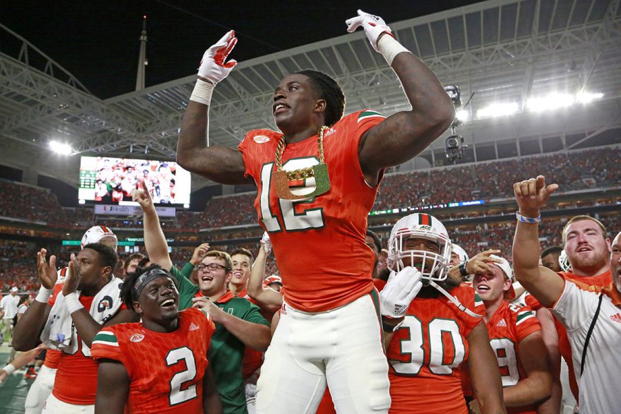 Miami Hurricanes defensive back Malek Young (12) wears the turnover chain after an interception in the second quarter against Notre Dame on November 11, 2017, at Hard Rock Stadium in Miami Gardens, Fla. (Al Diaz/Miami Herald/TNS)