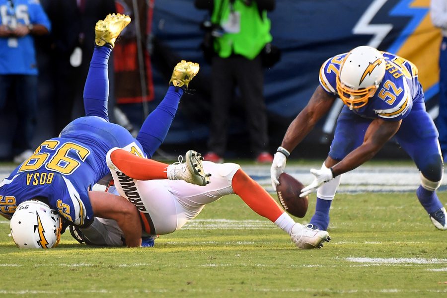 Los Angeles Chargers defensive end Joey Bosa sacks and forces a fumble on Cleveland Browns quarterback DeShone Kizer as Denzel Perryman recovers the ball in the fourth quarter on Sunday, Dec. 3, 2017 at the StubHub Center in Carson, Calif. (Wally Skalij/Los Angeles Times)