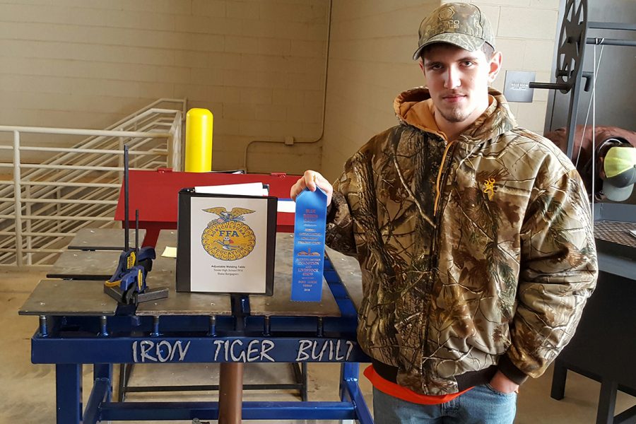 Sophomore+Blake+Berganini+holds+a+blue+ribbon+that+he+won+at+an+FFA+competition.+The+next+meet+will+be+on+Feb.+8+in+San+Antonio.+Submitted+photo