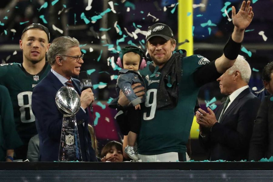 Philadelphia Eagles quarterback Nick Foles (9) holds his son and waves during the victory celebration after Super Bowl LII on Sunday, Feb. 4, 2018, in Minneapolis, Minn. (Jeff Wheeler/Minneapolis Star Tribune/TNS)