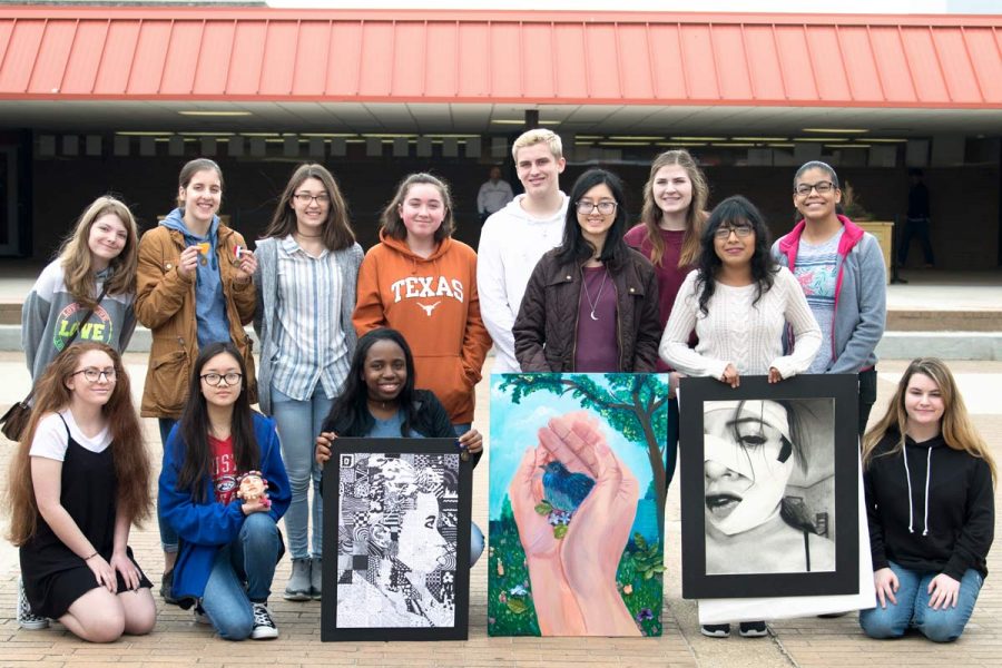 Art students pose with awards earned and their creations from the Visual Arts Scholastic Event or V.A.S.E.  These student competed with other art students from region at Pleasant Grove High School this past weekend.