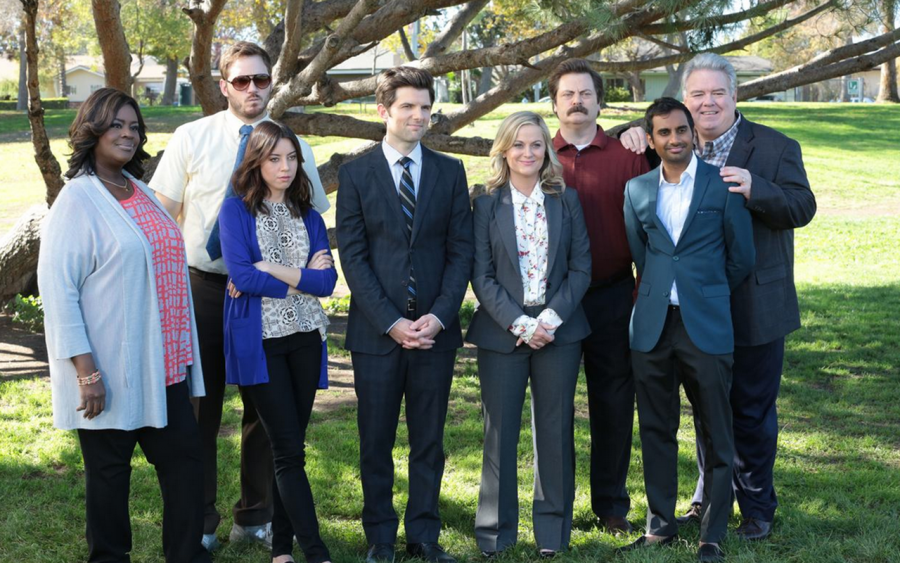 The cast poses for a picture, each displaying their diverse personalities.