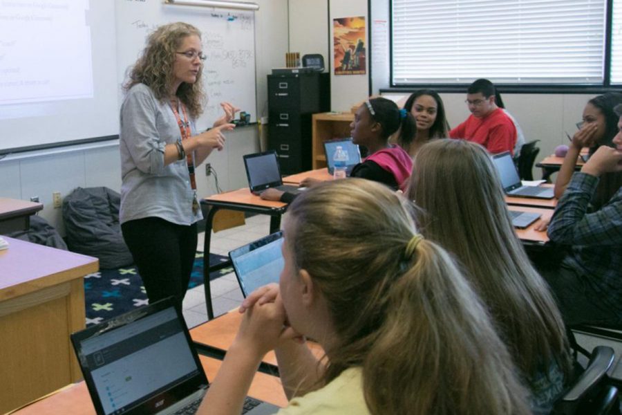 Algebra 2 teacher Nicole Ayers teaches a lesson. Ayers has been part of the tiger family for three years and will now teach at St. James. 