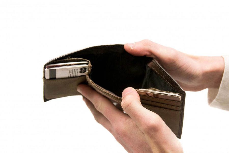 People are spending money recklessly instead of saving up for a rainy day. The wallet used to be full until the money was wasted. 