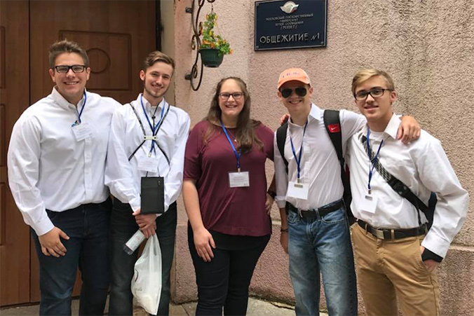 Seniors Briley Court, Colton Capps, Abbott Lawrence, Kaden Lloyd and chaperone Victoria Pearcy pose in front of their hotel in Moscow, Russia. The group has been filming various stories during the World Cup. 