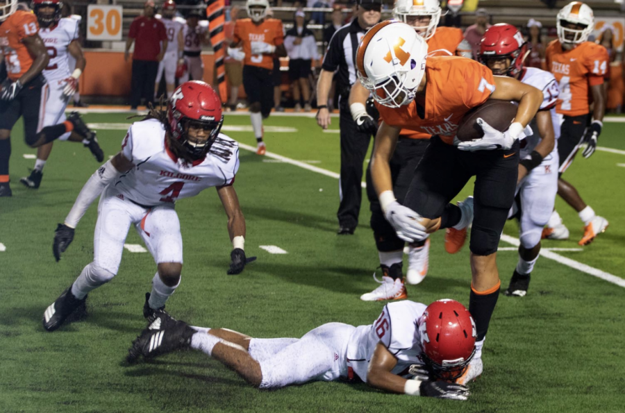 Senior wide receiver Myles Washington attempts to break away from a Kilgore defender. The Tigers play the John Tyler Lions tonight at Tiger Stadium at 7 p.m.