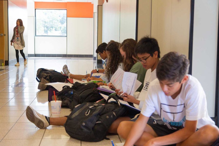 Mrs. Martins students in the Math and Science building sit outside of class. There was a suspected gas leak that was caused by sewage water evaporating from the pipes in the sinks of the science classrooms.