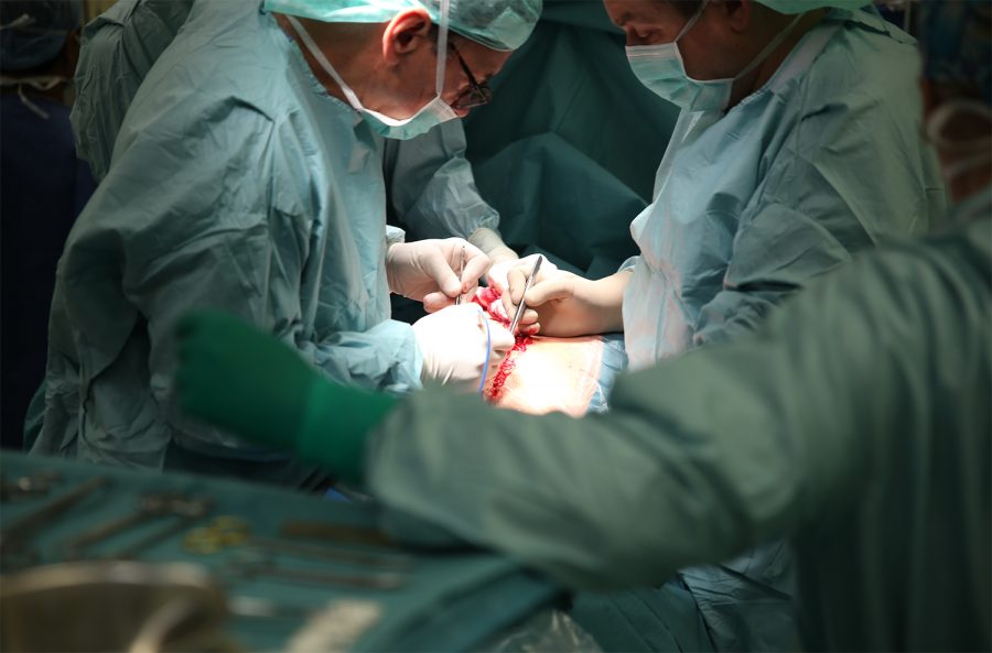 Polish surgeons perform surgery on a patient in the operating theatre as its known as in Europe. 