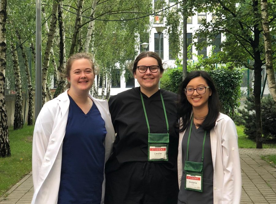 FutureDocs students Courtney Cross, Leslie Shannon and Victoria Van wear scrubs and lab coats after their afternoon Gene Therapy rotation.