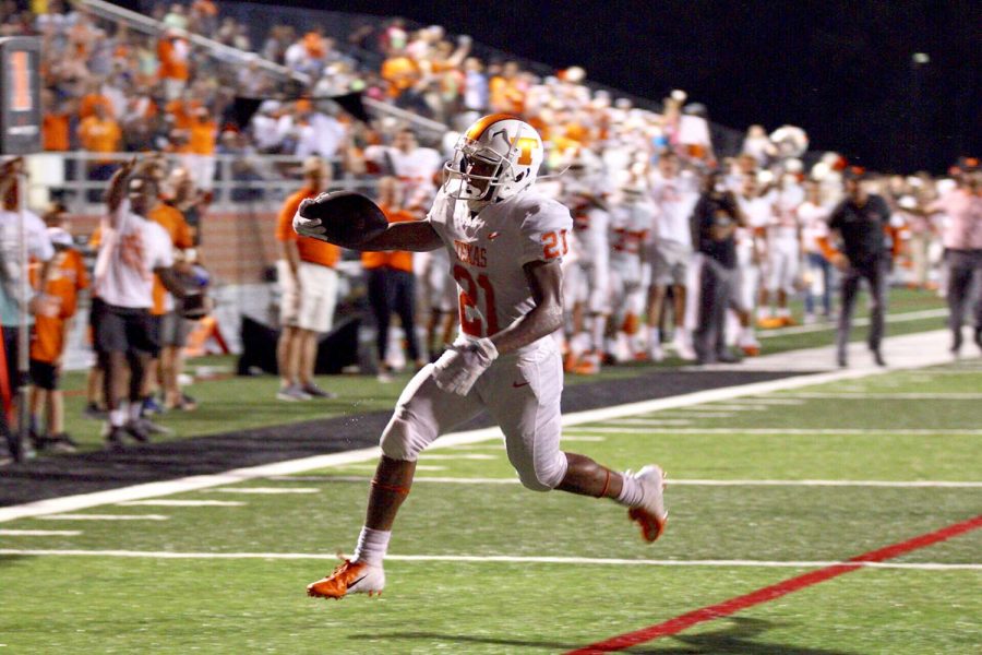 Running back Chris Sutton extends the ball as he crosses the goal line in the Texas High Tigers win against the Liberty Eylau Leopards September 14, 2018. The Tigers improved their record to 2-1 with the win against their cross--town rival.