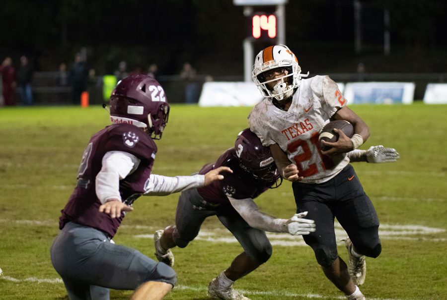 Wide receiver Chris Sutton runs the ball and is tackled by a Sherman defender. The Tigers lost 27-21 to the Sherman Bearcats on Oct. 19.